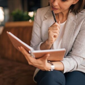 woman looking at planner