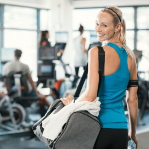 woman walking through the gym