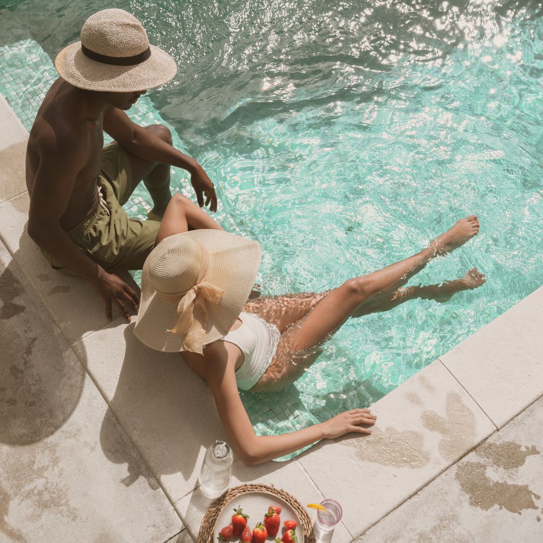 two people relaxing in pool
